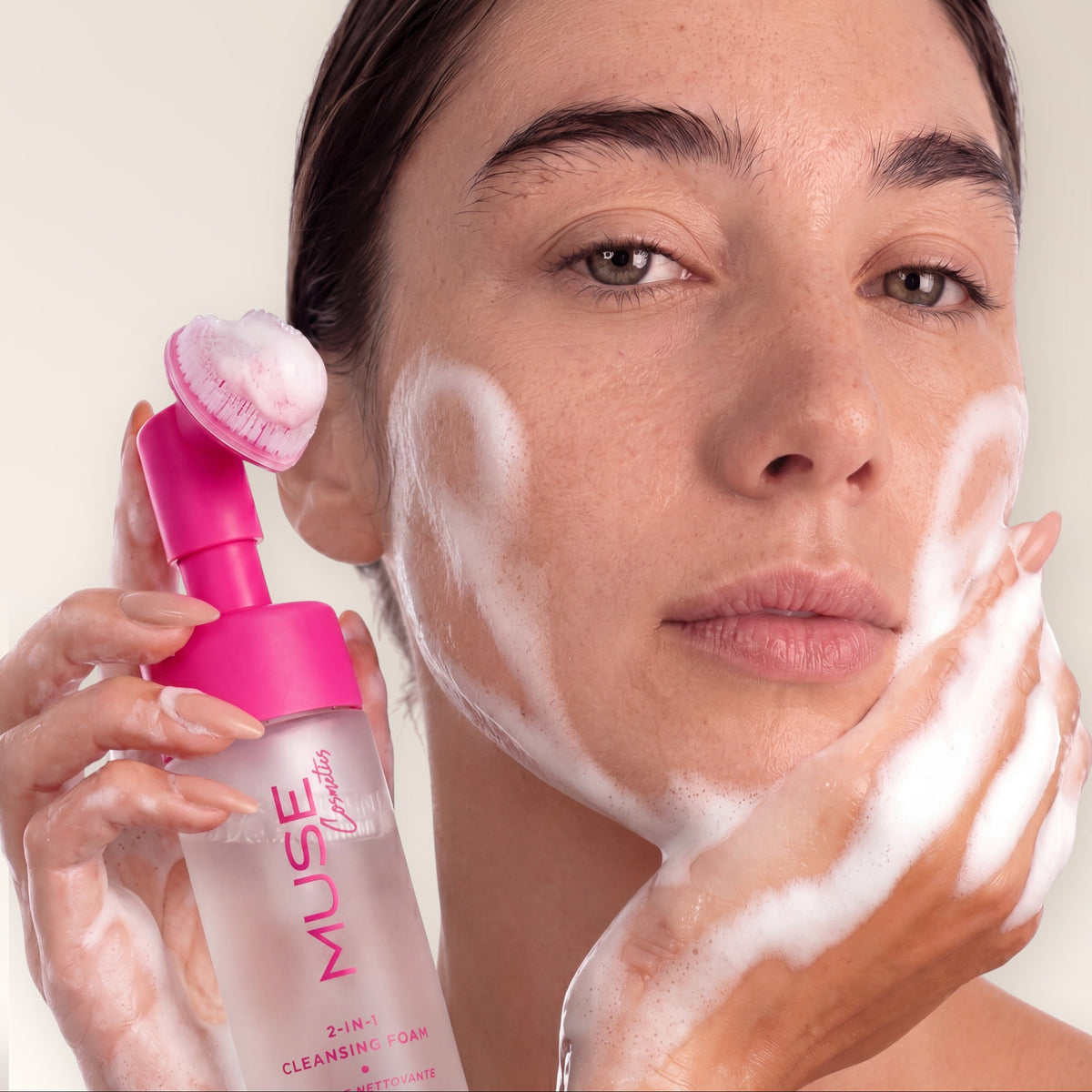 Woman cleansing her face with MUSE Travel cleansing foam